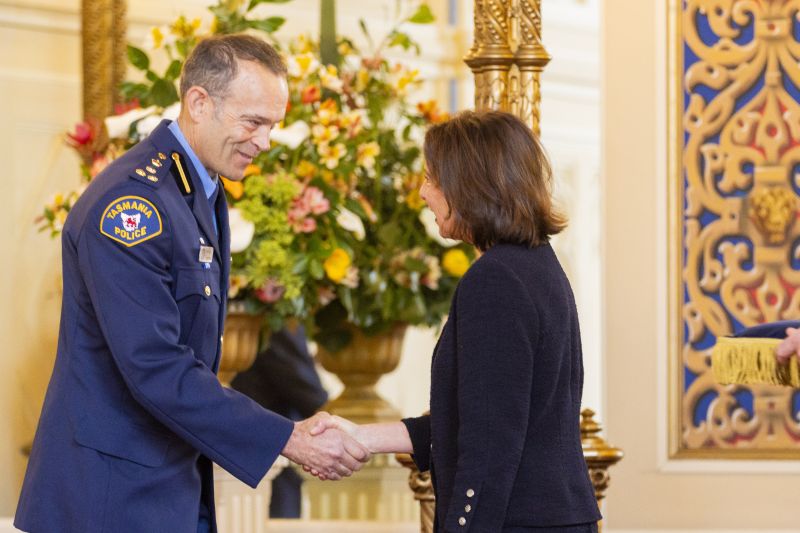 The Governor shakes the hand of a man
