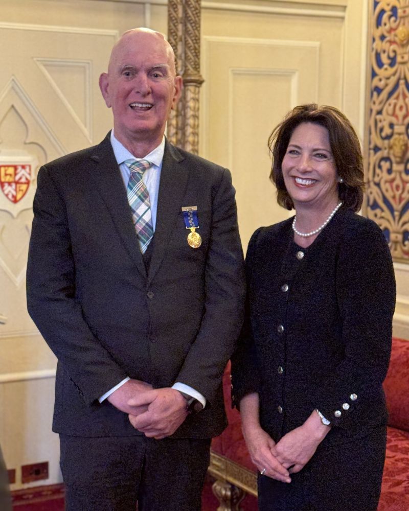 The Governor stands next to a man