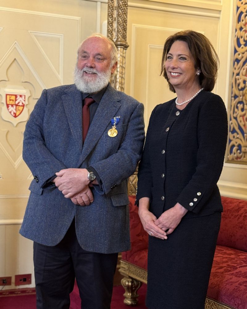 The Governor stands next to a man