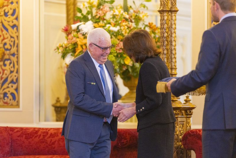 The Governor stands next to a man
