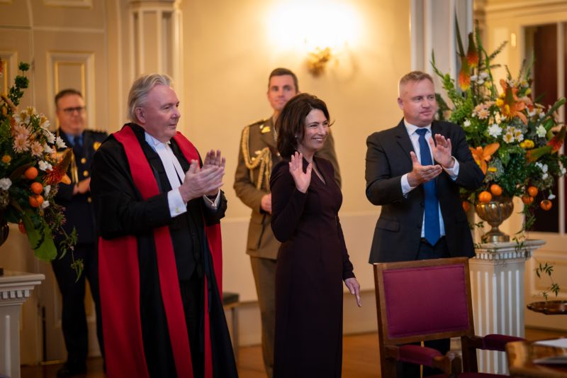 The Governor is applauded by the Chief Justice and the Premier
