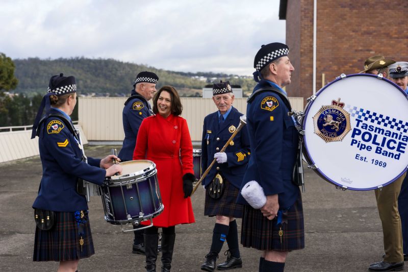 The Governor speaks with members of the Tasmania Police pipe band at the Graduation Ceremony for Training Course 1/2026
