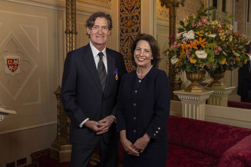 The Governor stands next to a man