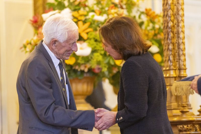 The Governor stands next to a man