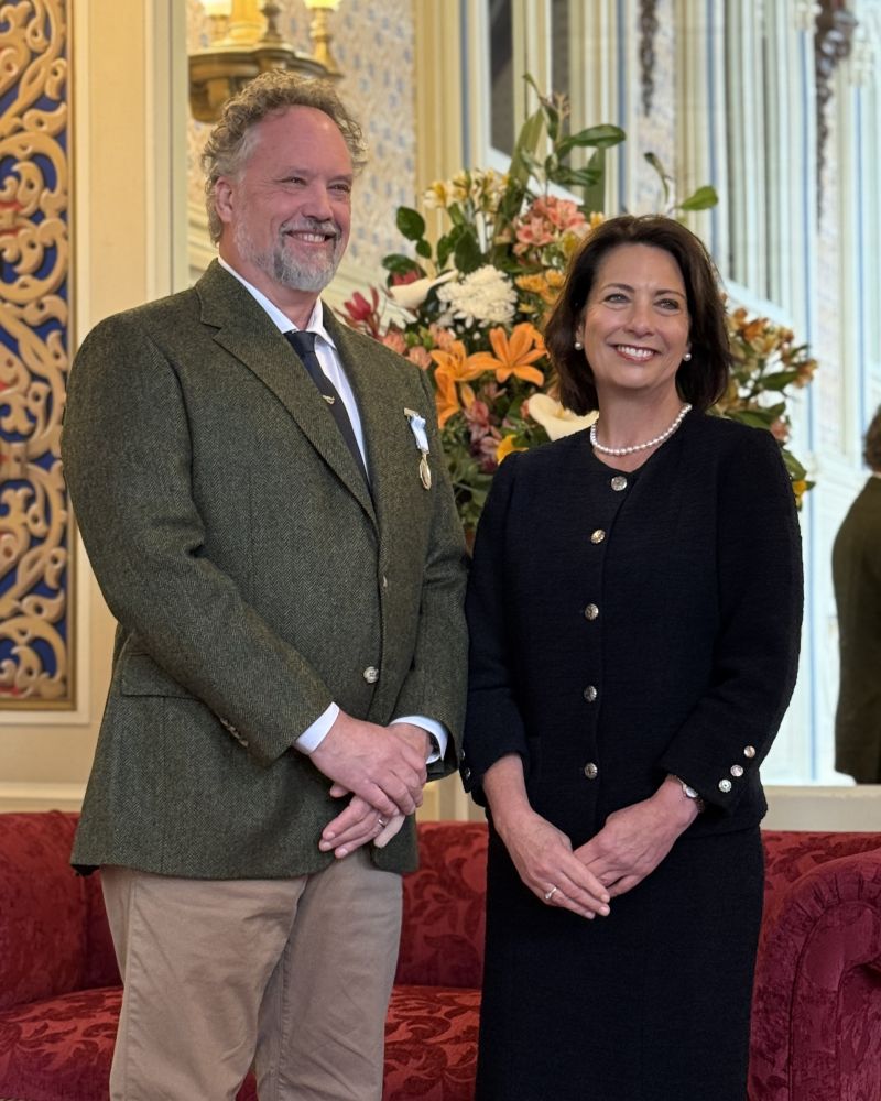 The Governor stands next to a man