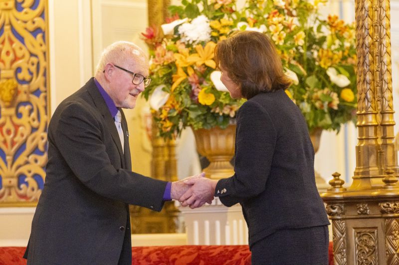 The Governor stands next to a man