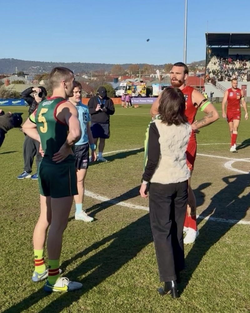 The Governor tosses a coin at the start of the Tasmanian Devils vs Gold Coast VFL match