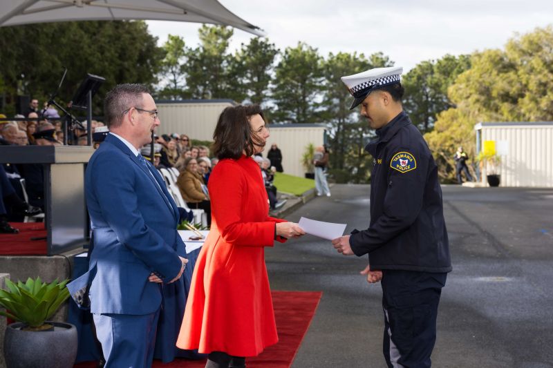 The Governor presents a certificate to a new constable at the Graduation Ceremony for Tasmania Police Training Course 1/2026
