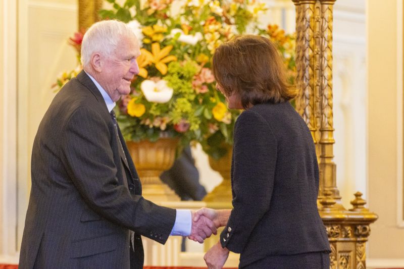 The Governor stands next to a man