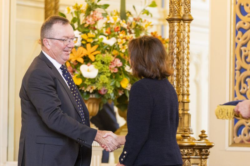The Governor shakes the hand of a man