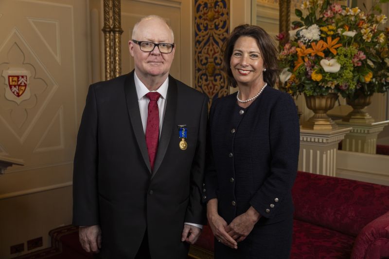 The Governor stands next to a man