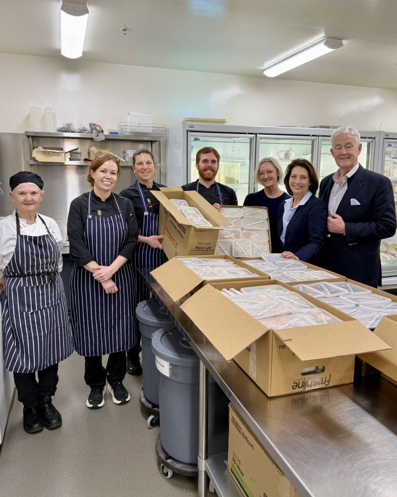 The Governor and Dr Walters stand with St Vincent de Paul Tasmania CEO Connie Digolis and Government House Kitchen Team members
