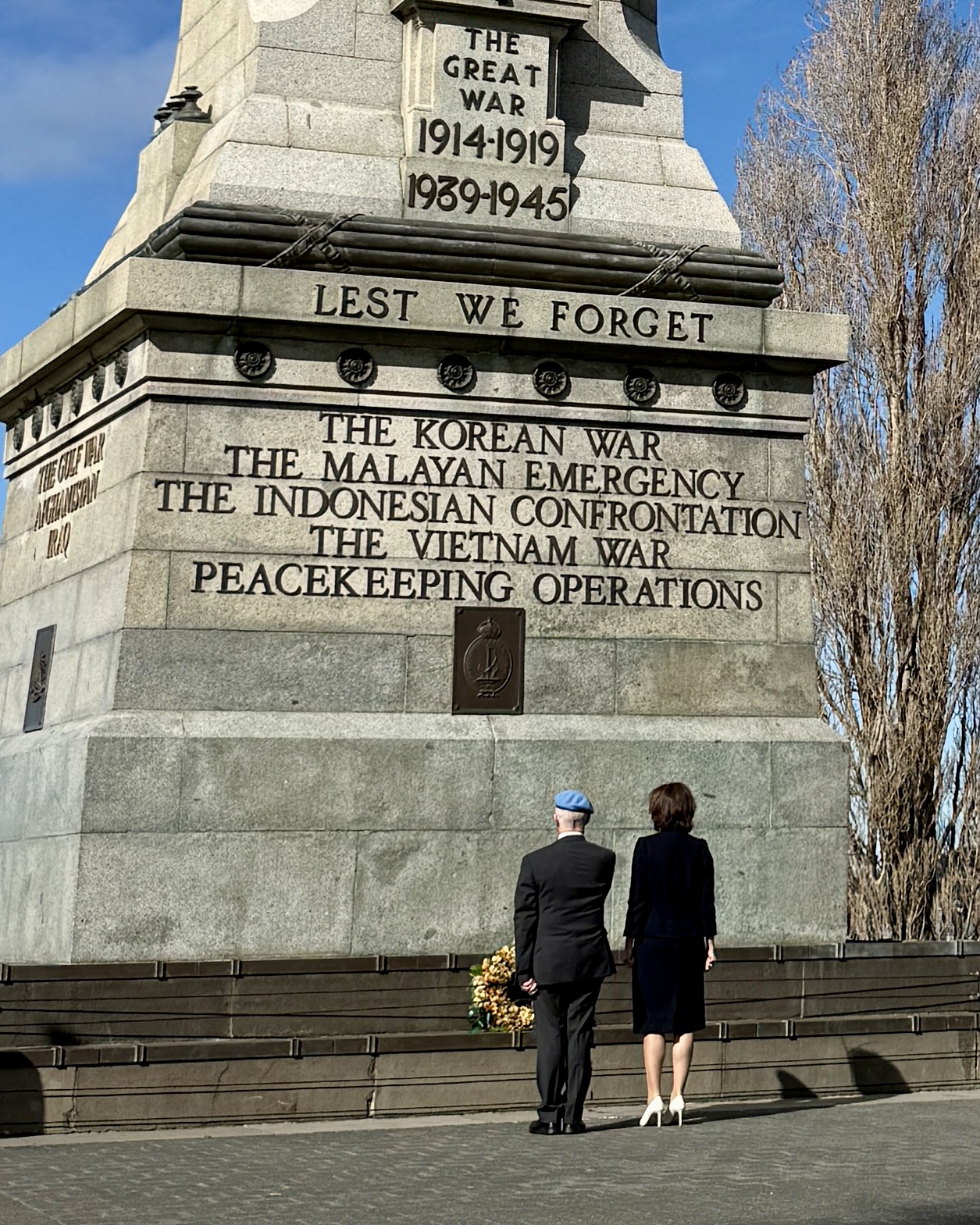 The Governor and a man lay a wreath at the Hobart Cenotaph