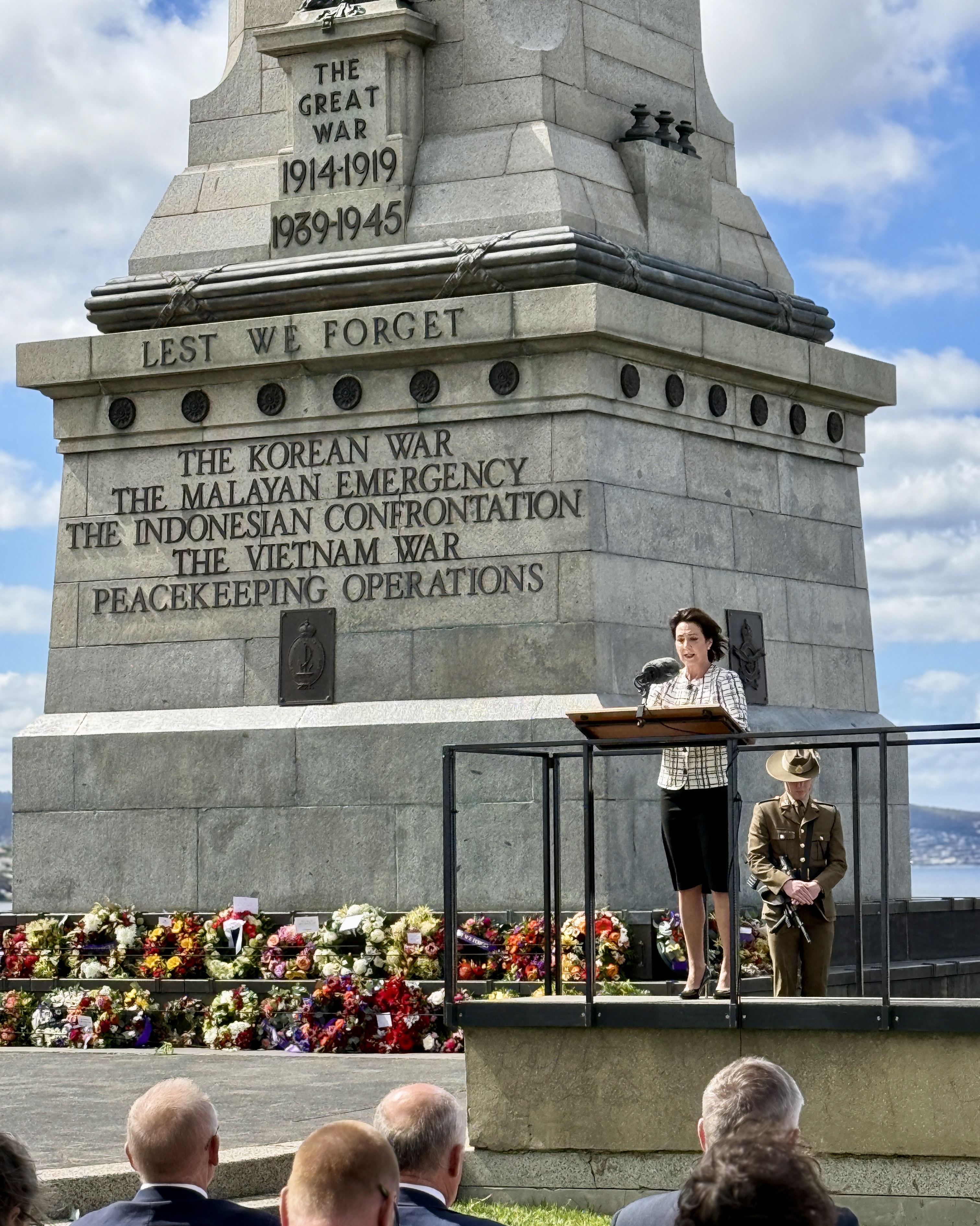 The Governor stands at a lectern at the foot of the Hobart Cenotaph