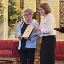 Her Excellency presents a life membership to Debbie Emmerton