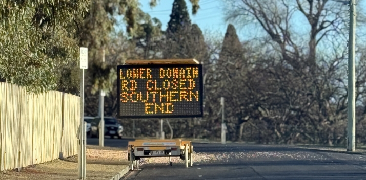 An image of Lower Domain Road with a sign listing an upcoming road closure