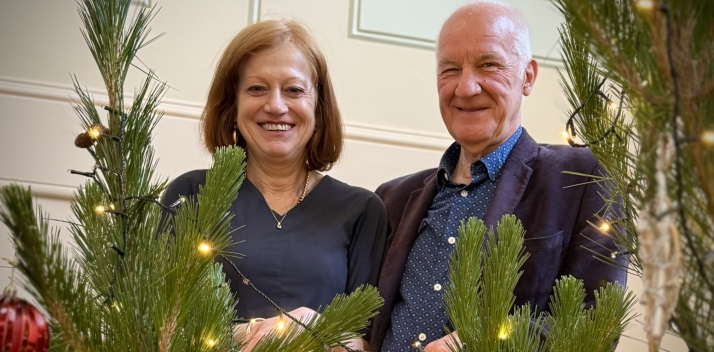 The Governor and Professor Chalmers next to the Government House Christmas Tree.