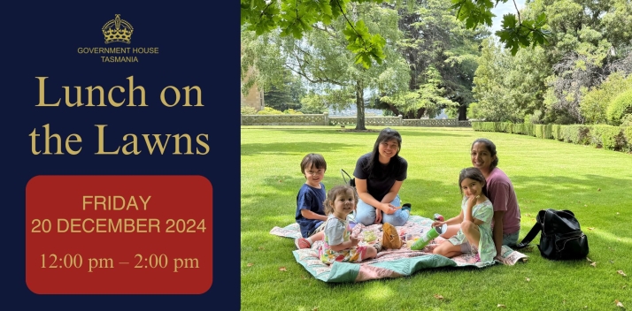 People enjoying a picnic on the lawn at Government House