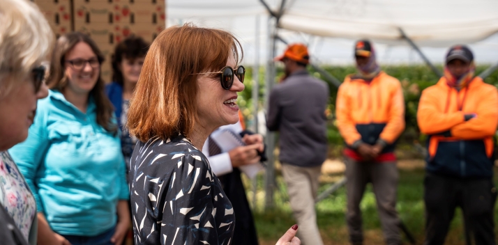 Her Excellency wearing sunglasses and talking to staff at the Mountford Berry Farm