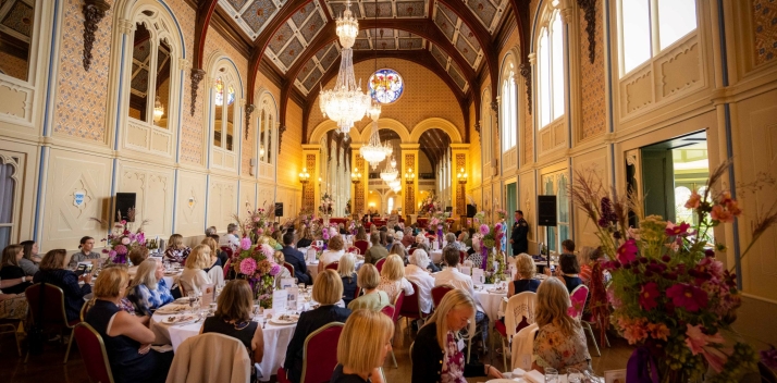 Guests at tables in the Government House ballroom during the luncheon.