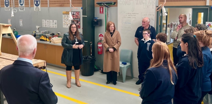 The Governor and Professor Chalmers in a construction workshop at Huonville High School with students and teachers