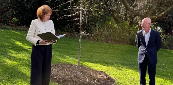 Her Excellency and Peter Gutwein standing next to a new oak tree