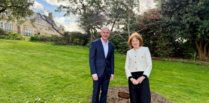 Her Excellency and Peter Gutwein standing next to a new oak tree on the Government House lawn