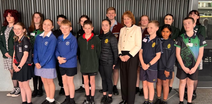 Her Excellency with 16 primary and secondary school students
