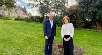 Her Excellency and Peter Gutwein standing next to a new oak tree on the Government House lawn