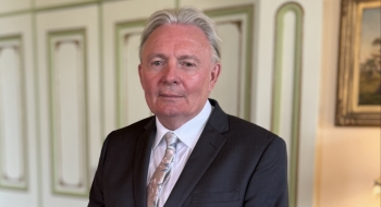 Man standing and facing the camera